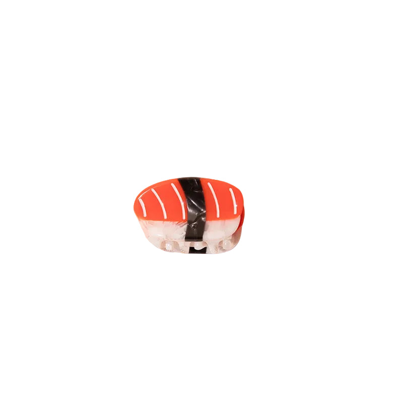 Sushi with rice, salmon, and nori on a yellow background