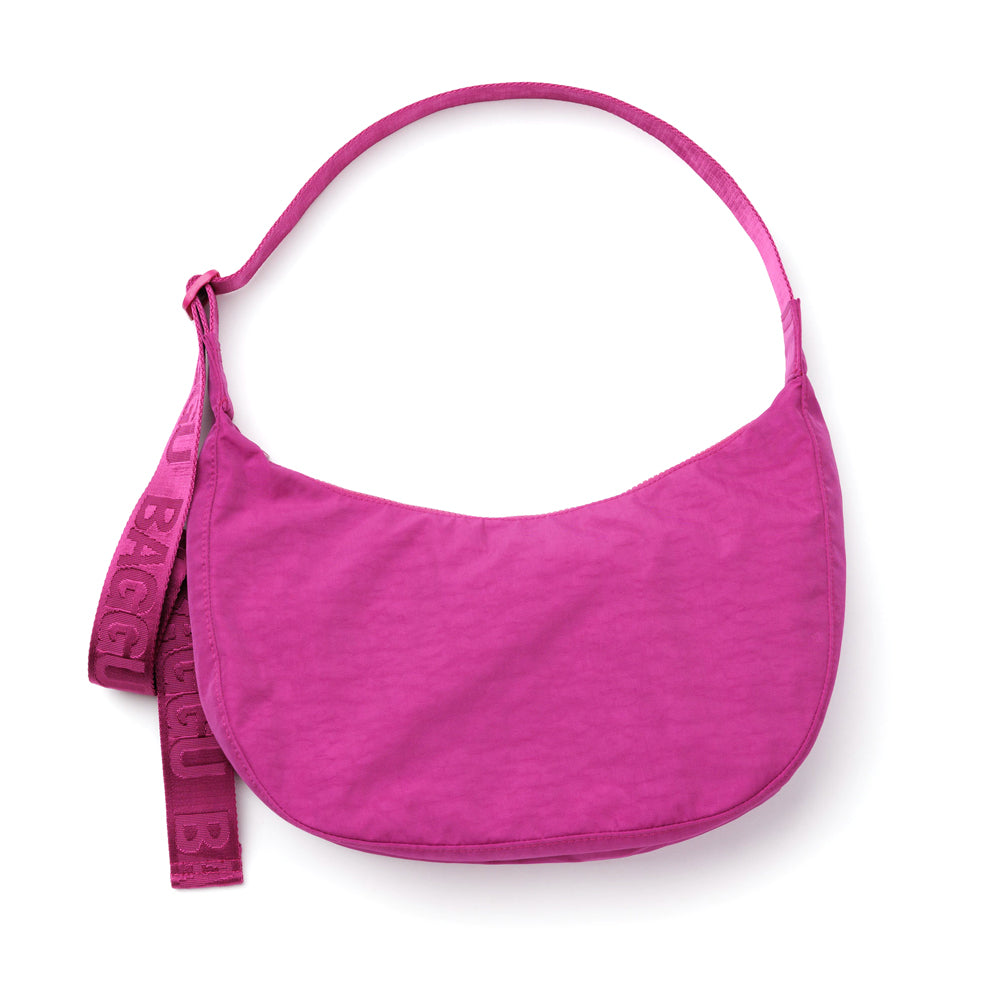 Pink handbag with a strap on a white background