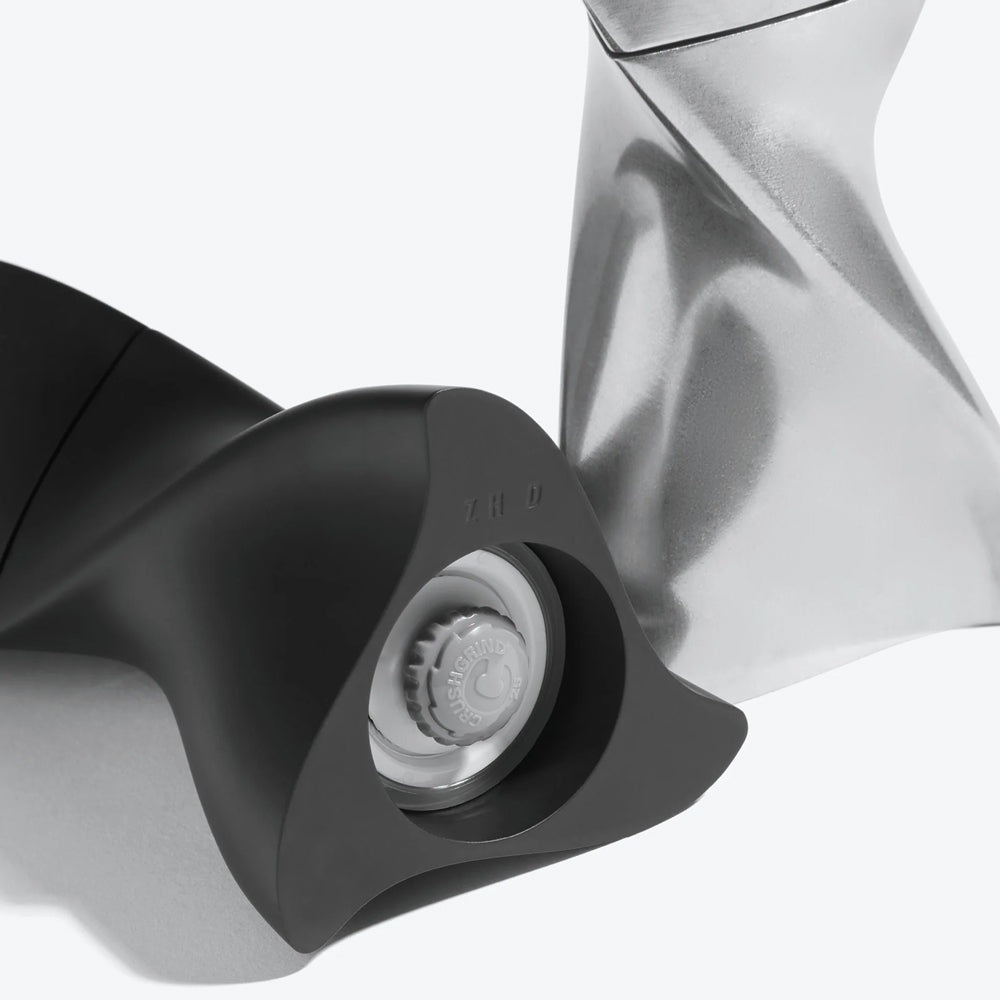 Close-up of a black and silver grinders on a white background