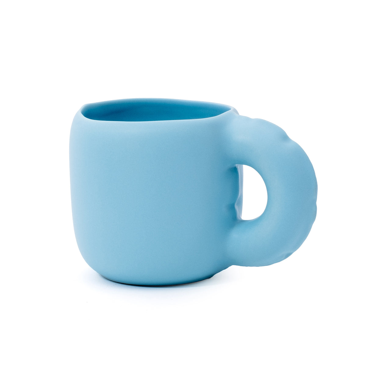 A light blue ceramic mug with a unique, integrated loop handle, shown on a plain white background.