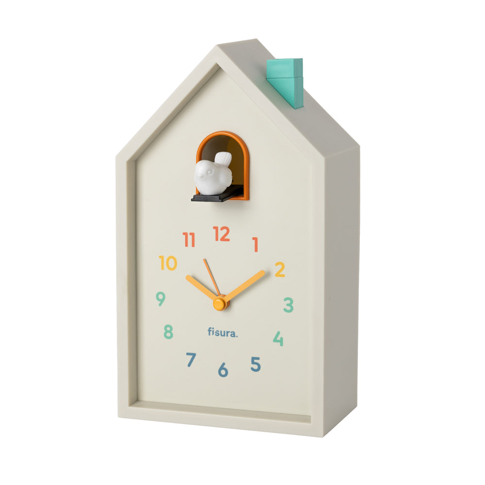 House-shaped clock with a bird design on a white background