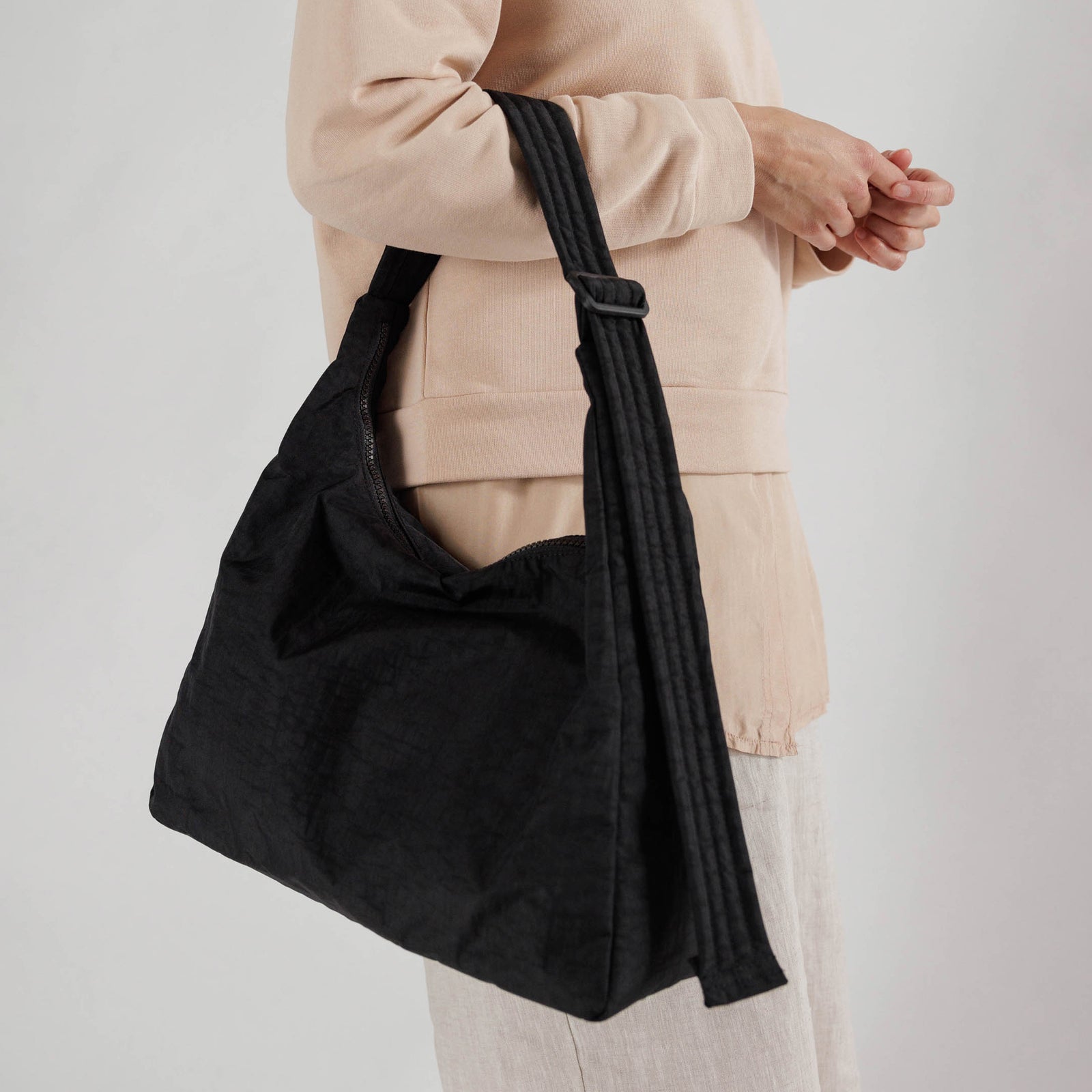 Black shoulder bag on a white background