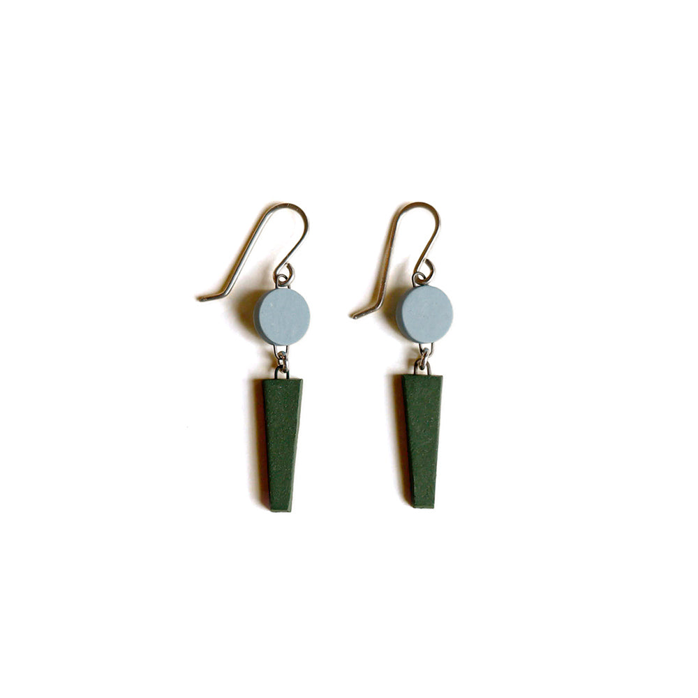 Pair of earrings with green cone-shaped drops on a white background