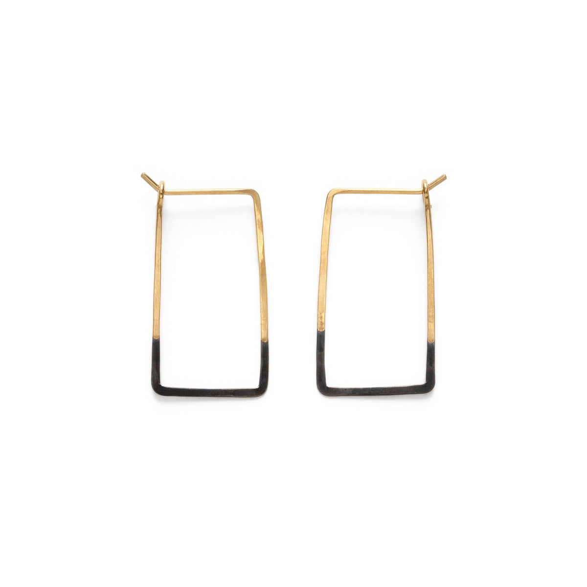 Pair of gold and black rectangle hoop earrings on a white background