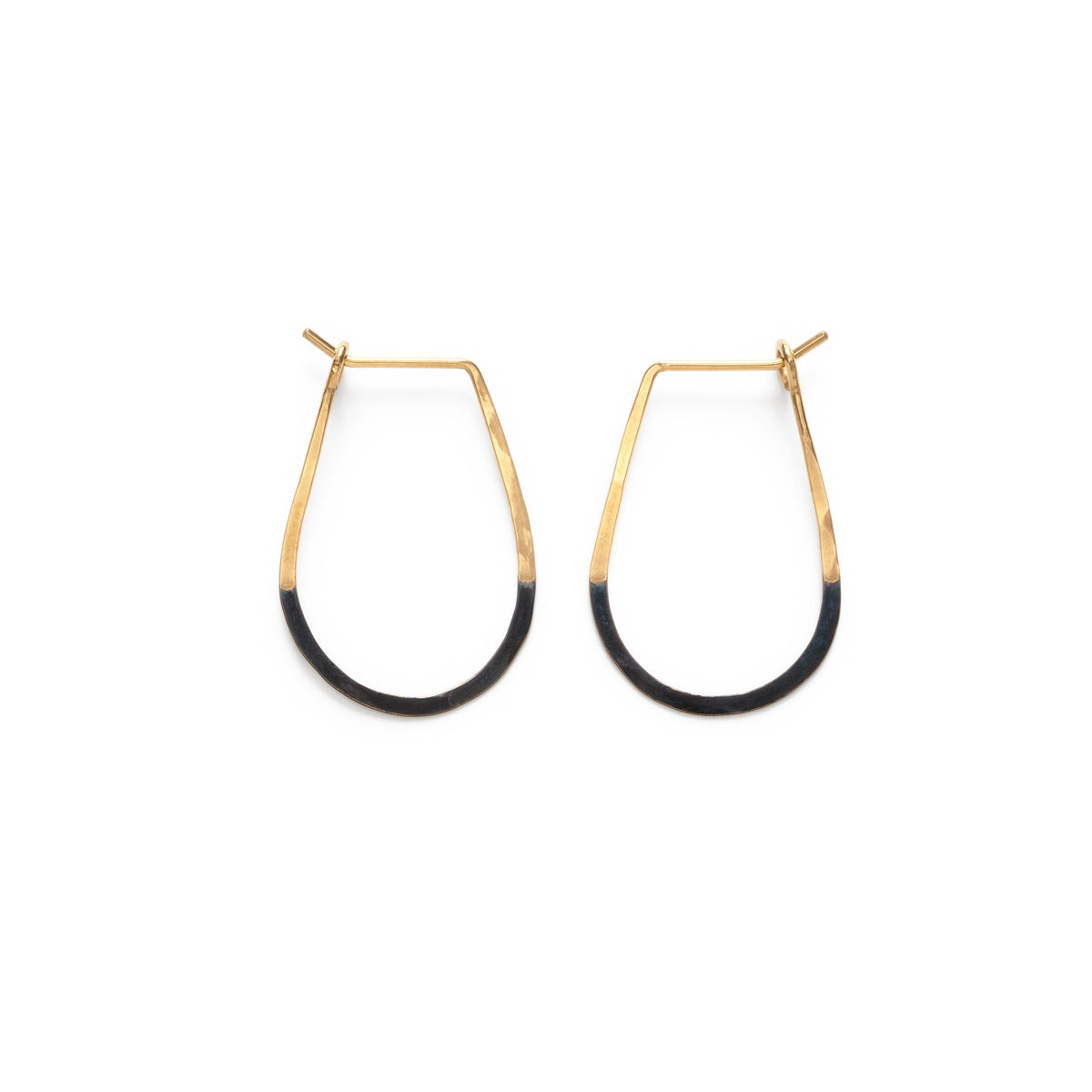 Gold and black hoop earrings on a white background