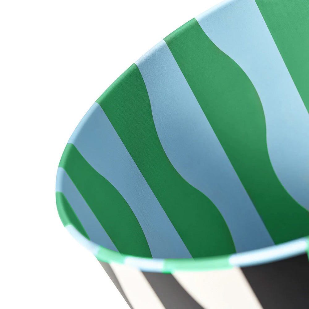 River Pattern Bin, black and white wavy vertical striped exterior, green and blue wavy striped interior.
