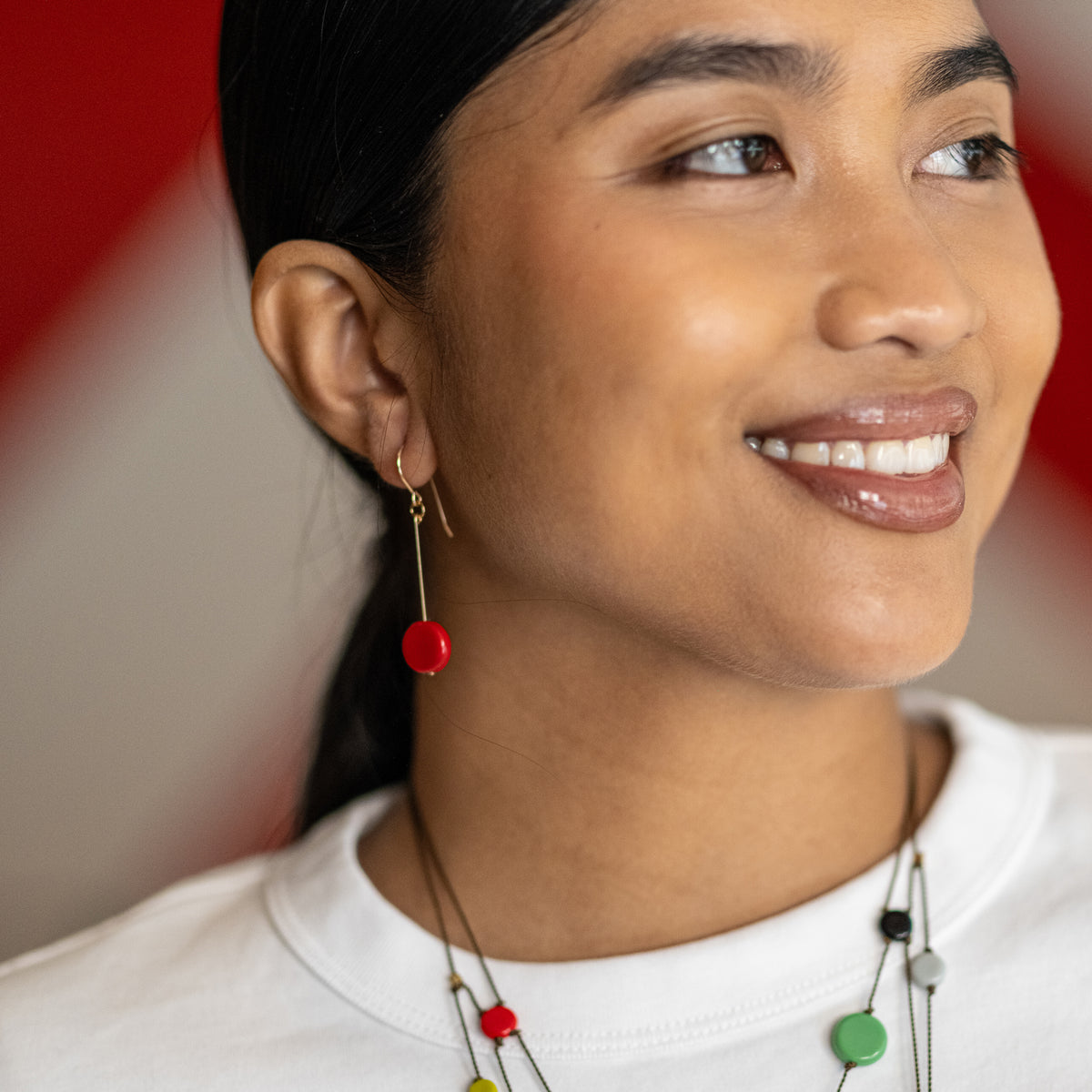 Model wearing earrings.