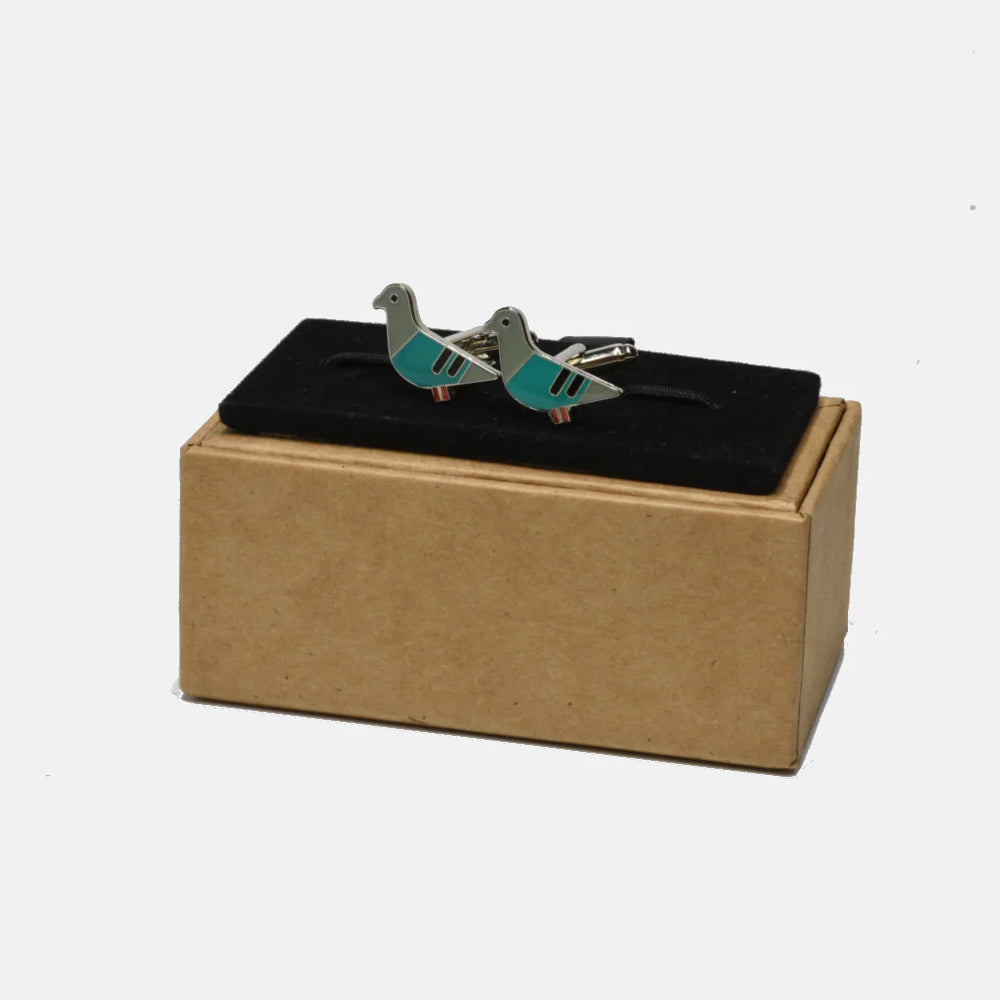 Pair of bird-shaped cufflinks in a box on a white background