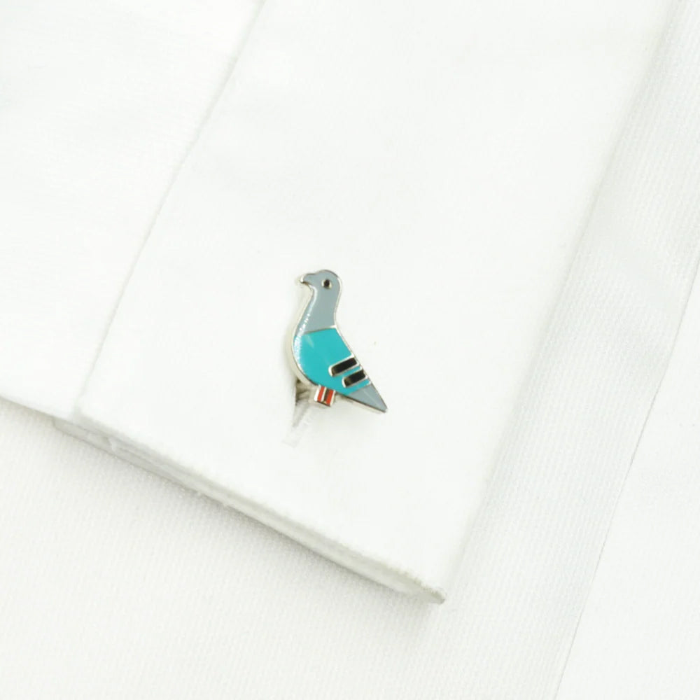 Pair of pigeon-shaped cufflinks on a white background