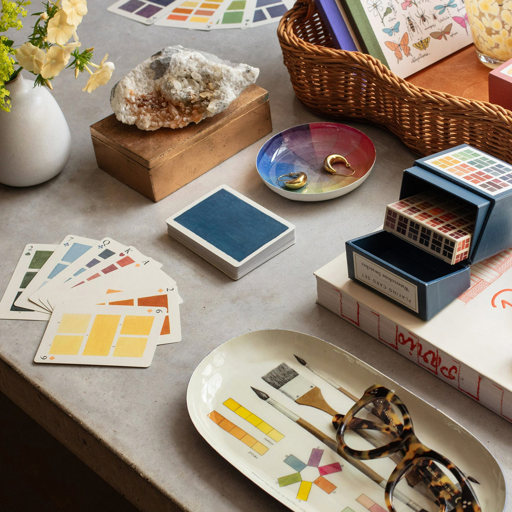 Playing cards and accessories on table.