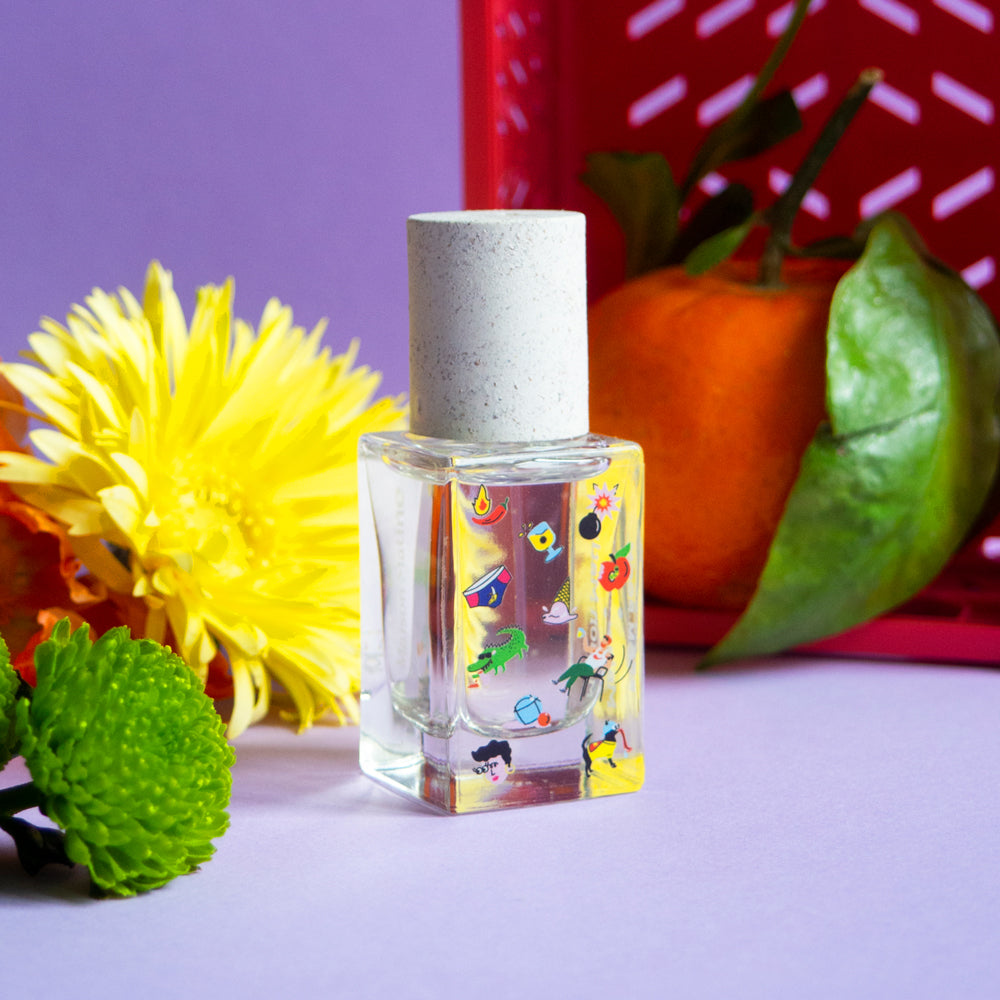 Maison Matine Poom Poom Eau de Parfum in a clear glass bottle with a white cap, shown next to its brown kraft paper packaging box on a white background.