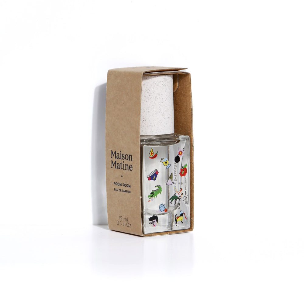 Maison Matine Poom Poom Eau de Parfum in a clear glass bottle with a white cap, shown next to its brown kraft paper packaging box on a white background.