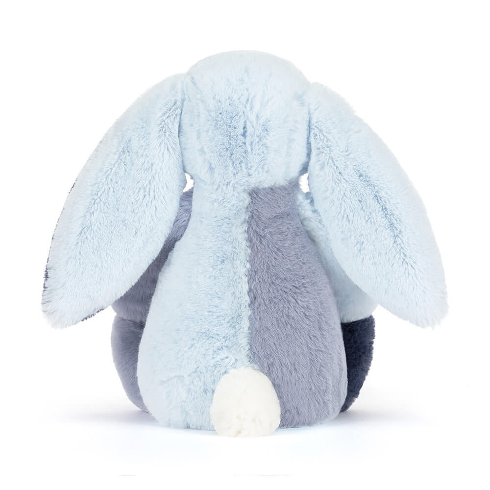Plush toy rabbit with light blue and gray colors on a white background