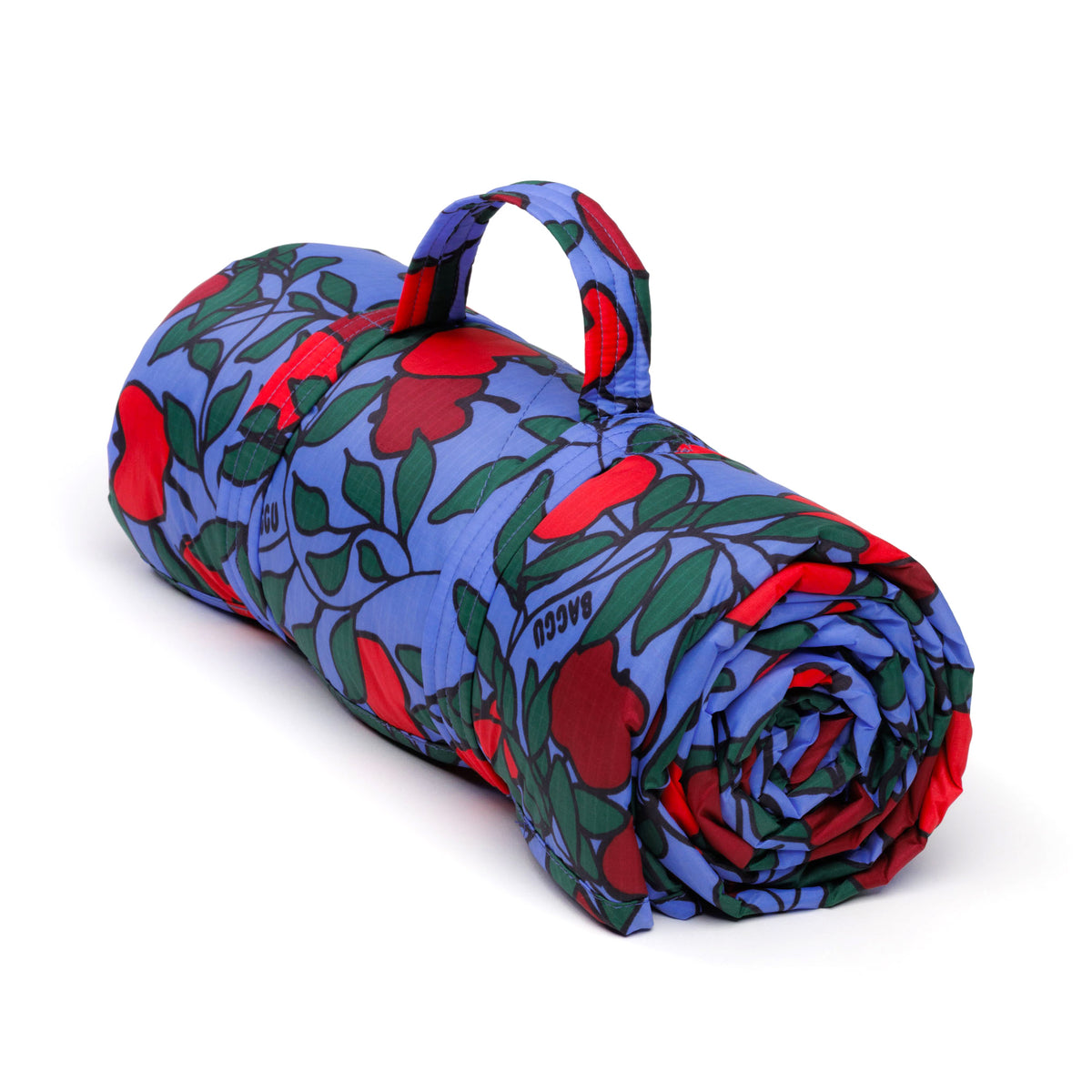 Rolled-up blanket with red and green floral pattern on a white background