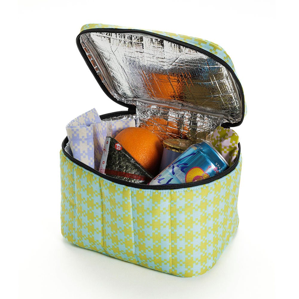 BAGGU puffy lunch box in mint pixel gingham, open with full lunch inside.