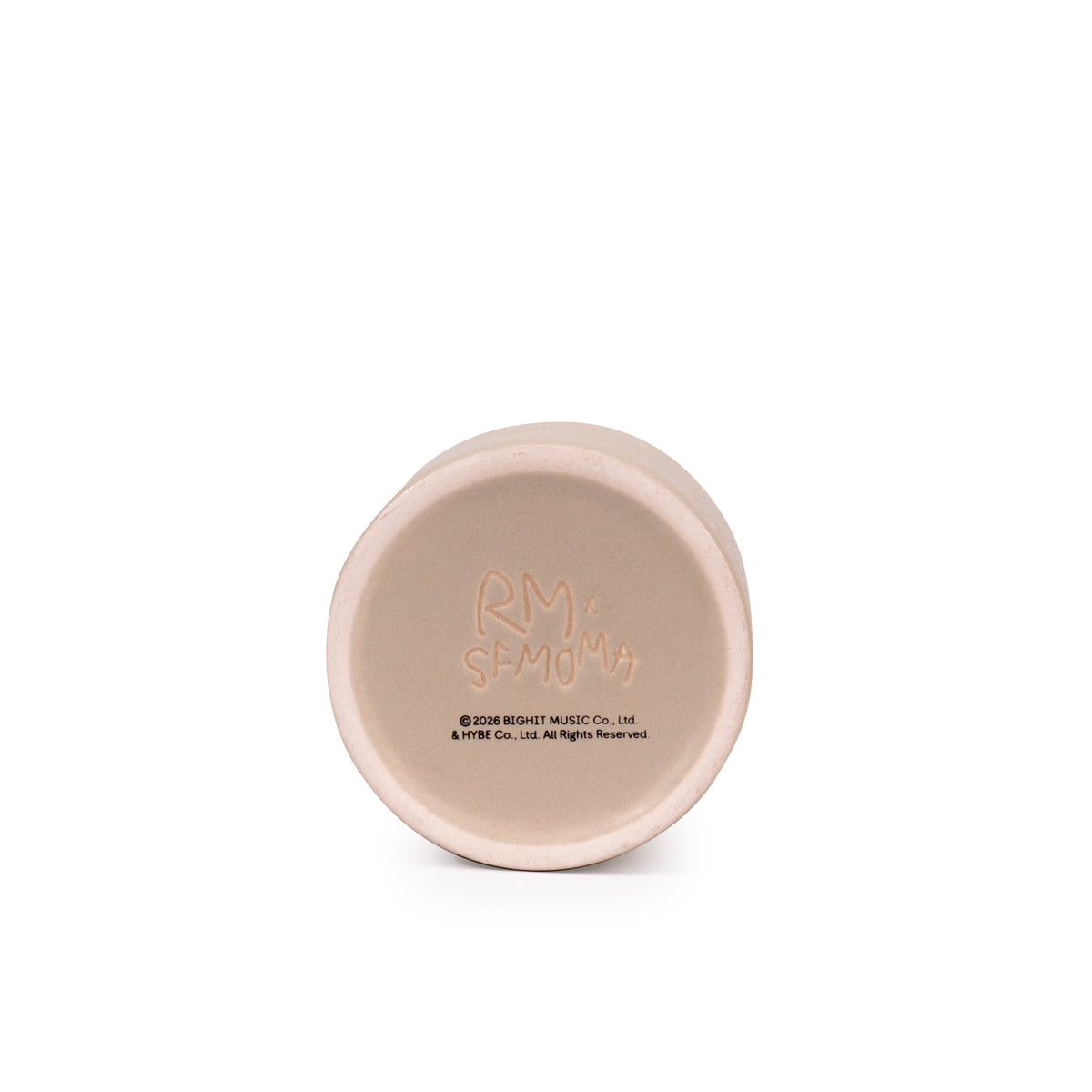 A cylindrical ceramic teacup in a matte light beige color, featuring embossed Korean text and the word 'HOME' on the front, set against a plain white background.