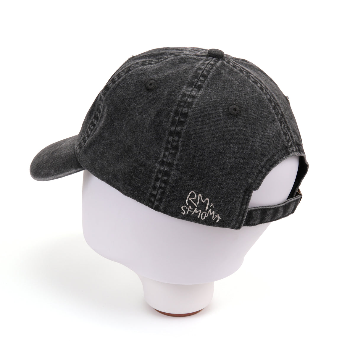 A washed black baseball cap with white embroidered text reading 'i don't know, but i like it'.