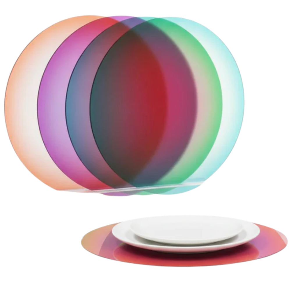 Four circular placemats with gradient colors on a white background