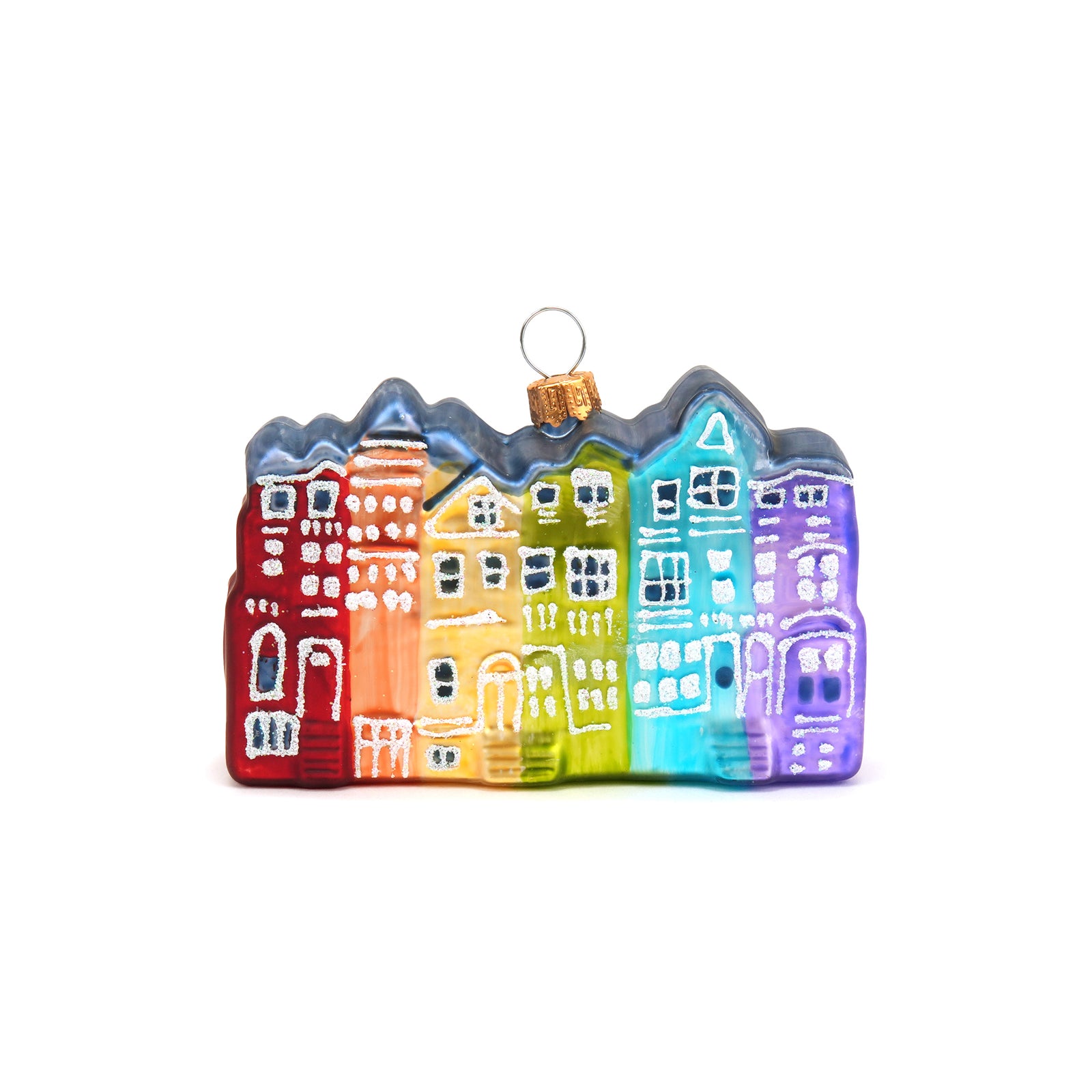 Colorful glass ornament shaped like a row of houses on a white background