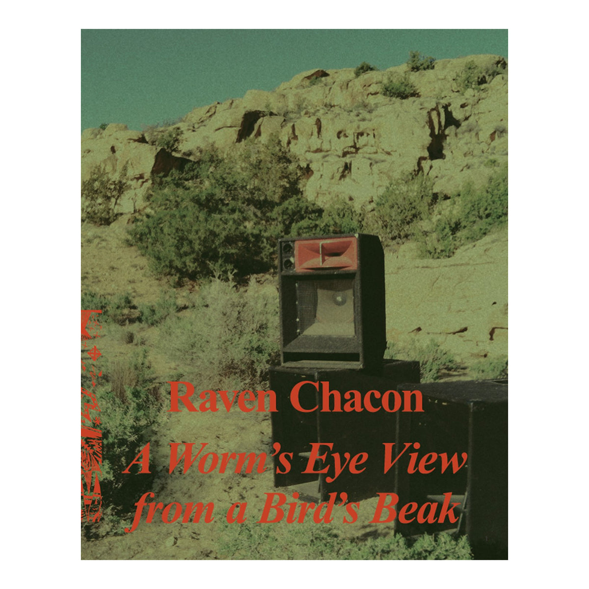 Book cover for 'A Worm's Eye View from a Bird's Beak' by Raven Chacon, featuring a vintage speaker set placed outdoors on a rocky, scrub-covered hillside with a green-tinted sky.