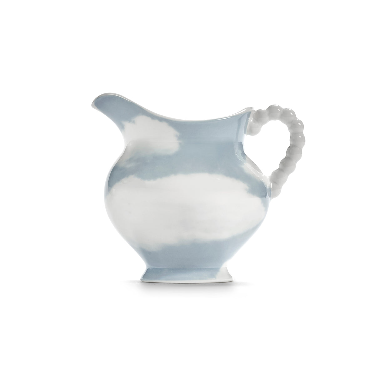 A porcelain pitcher with a light blue and white cloud pattern, featuring a textured white handle and spout, set against a plain white background.