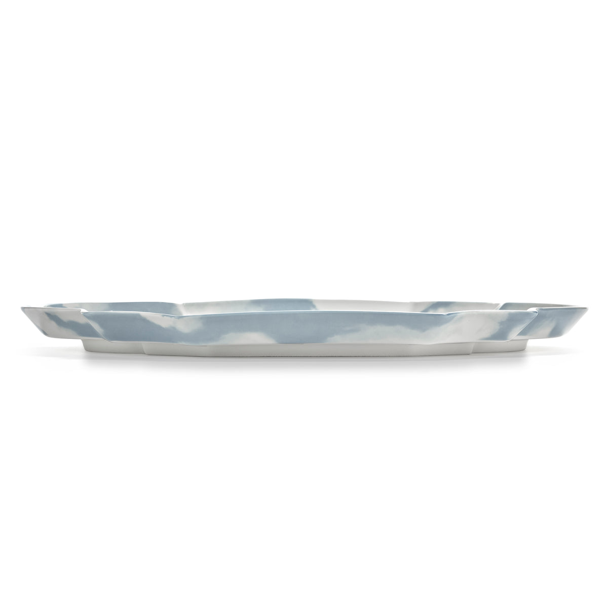 A porcelain plate with a scalloped rim, featuring a sky and cloud pattern in light blue and white, shown on a plain white background.