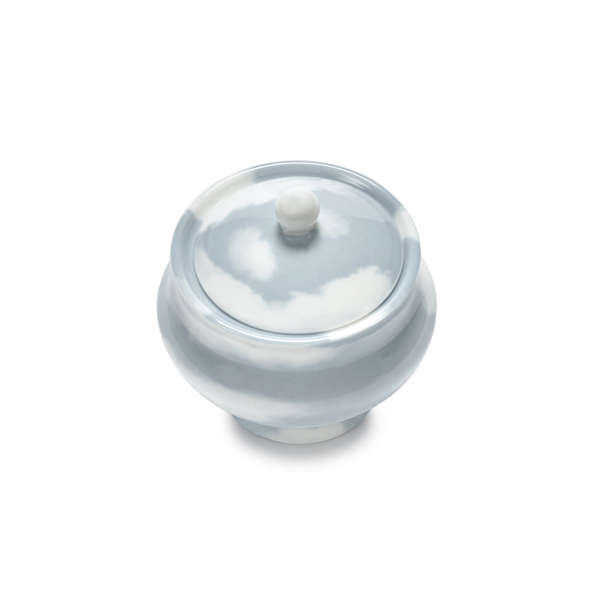 Top view of porcelain sugar bowl featuring a sky and cloud pattern in light blue and white, shown on a plain white background.