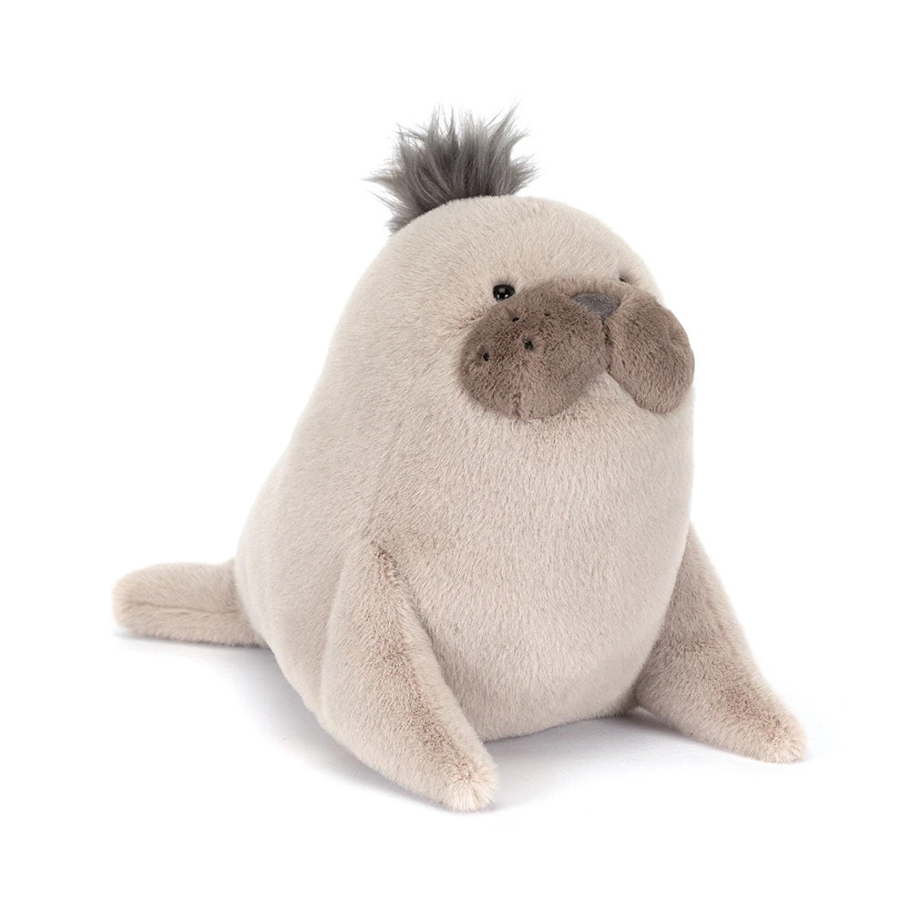 Plush toy seal on a white background