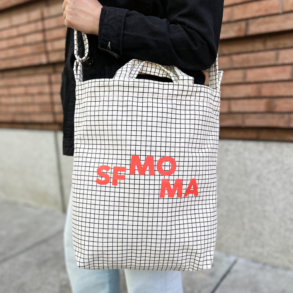 SFMOMA Grid Tote with its straps outstretched.