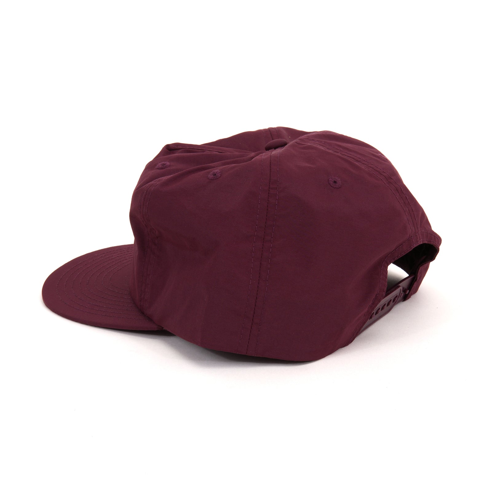 A maroon cotton flat-brim cap with green embroidered text reading 'SF MO MA' on the front, shown on a plain white background.