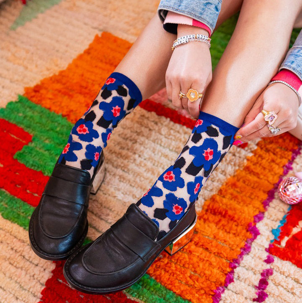 Lifestyle image of Bold Blue Floral Sheer Crew Socks.