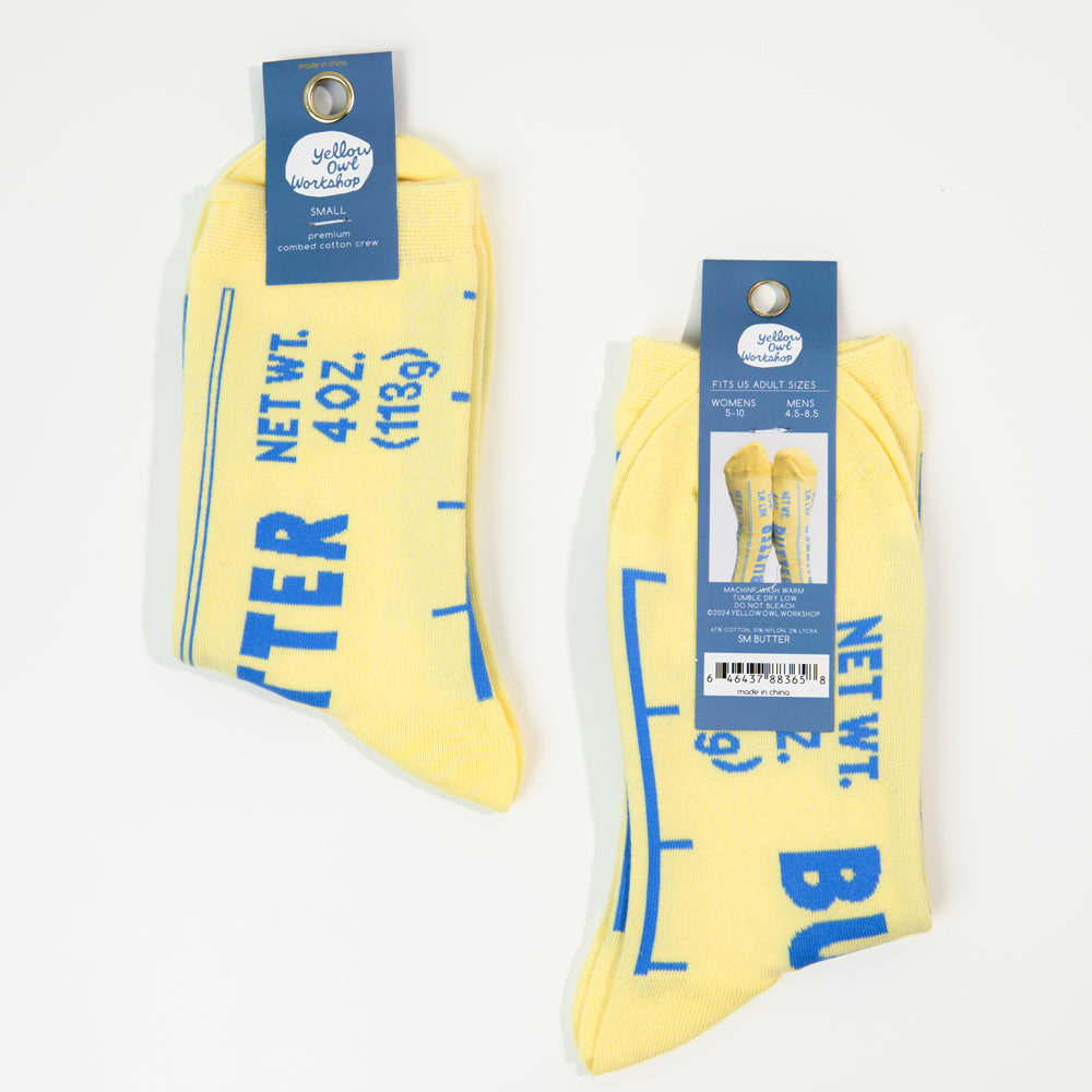 Yellow socks with blue text and packaging on a white background