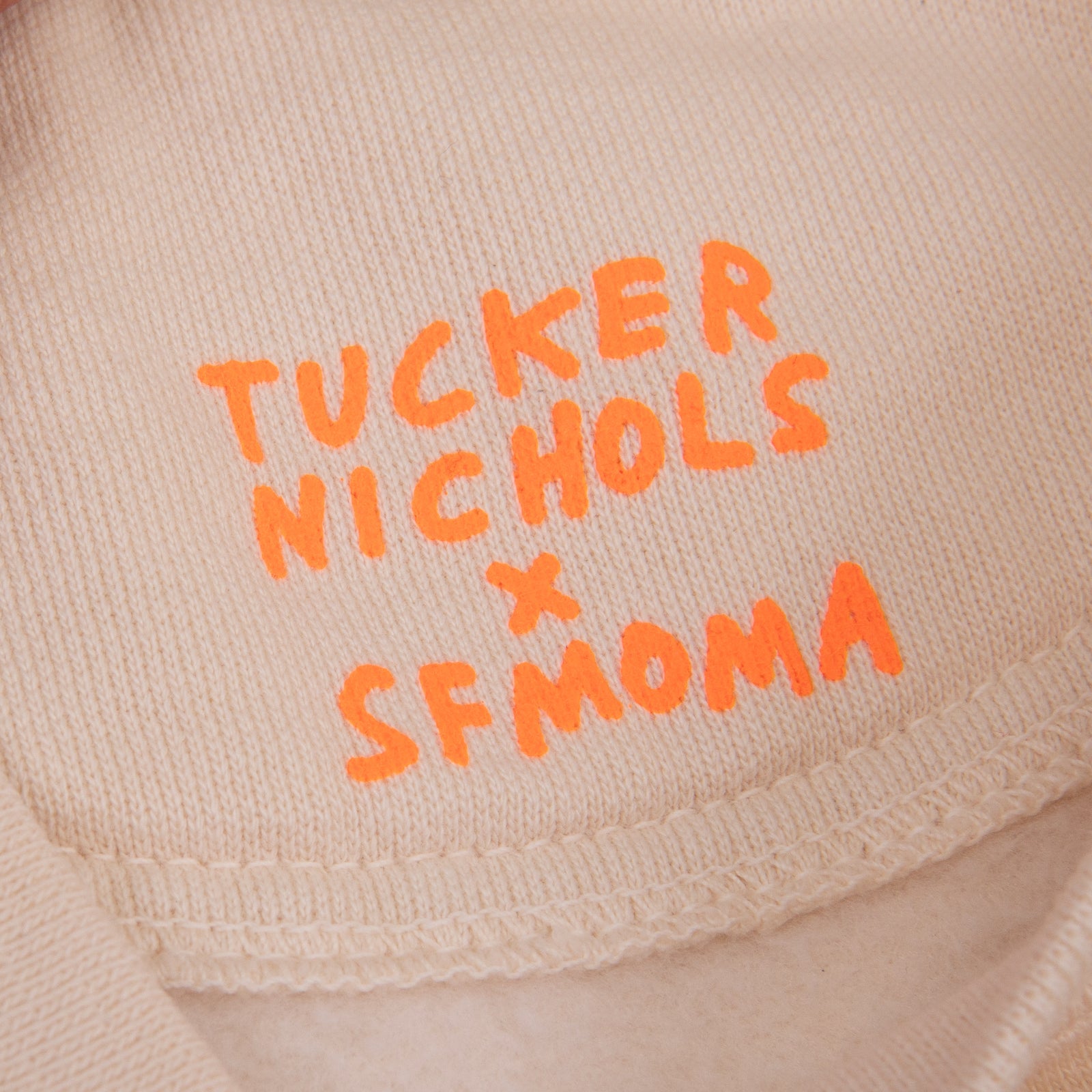 An ivory crewneck sweatshirt with 'San Fran' printed in green cursive across the chest, displayed flat against a white background.
