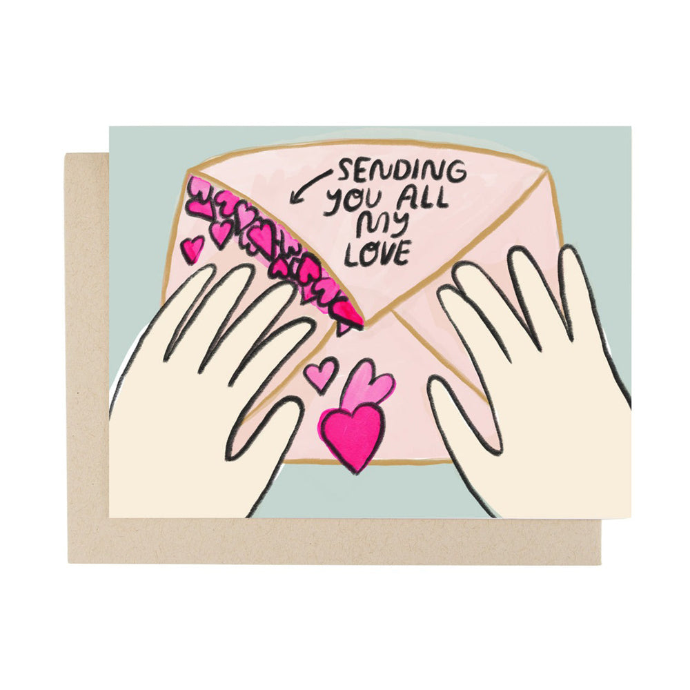 Greeting card with hands holding an envelope labeled 'Sending you all my love' on a light blue background.