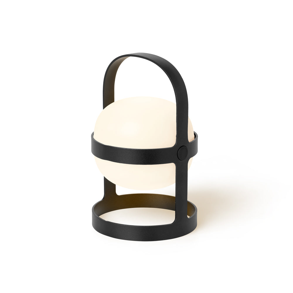 Modern outdoor lamp with black metal frame and white glass shade on a white background