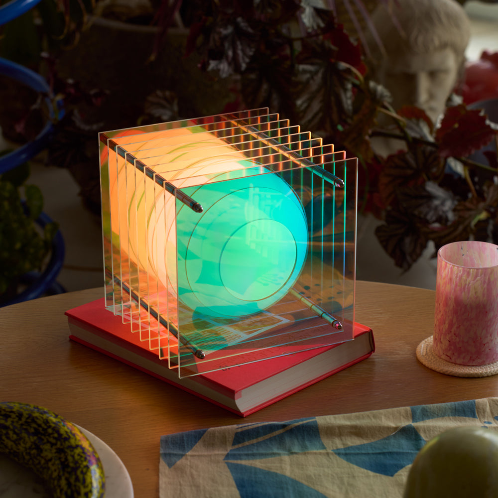 Colorful light fixture on a book with a blurred background