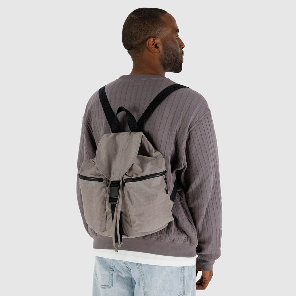 Model wearing backpack.