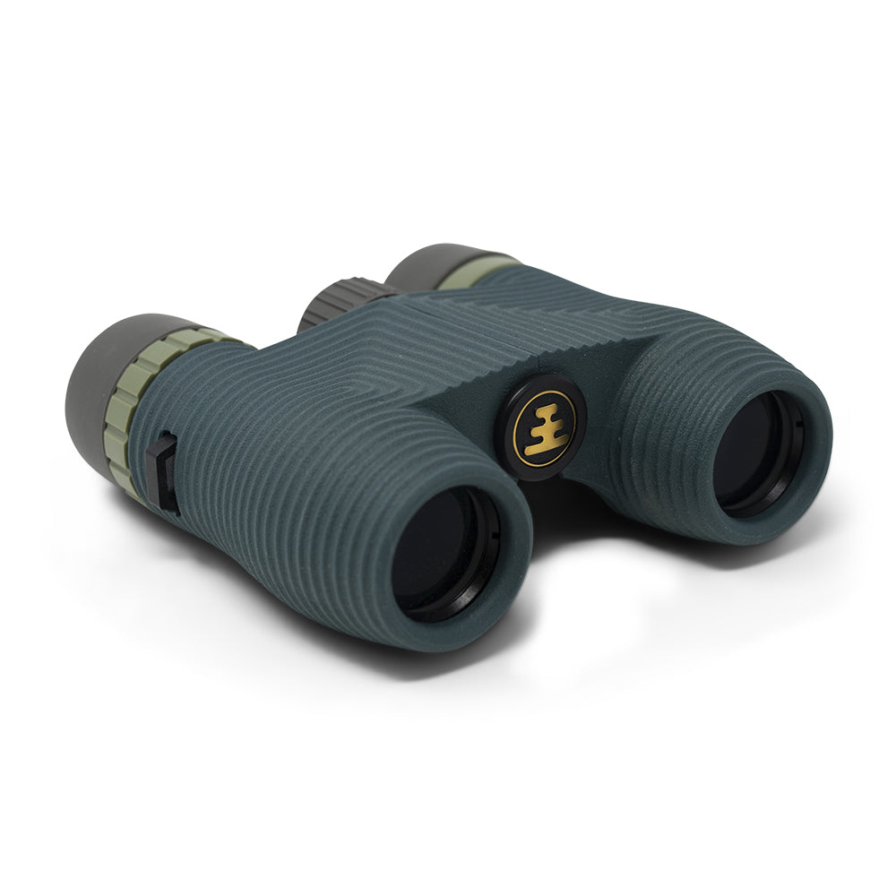 Green binoculars with a brand logo on a white background
