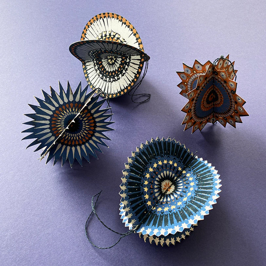 Pack of East End Press printed paper ornaments on a white background