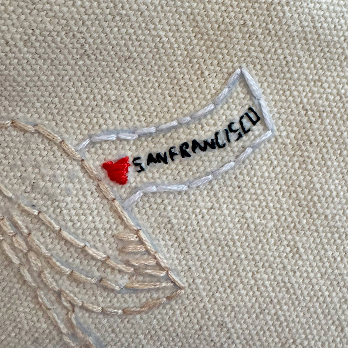 Embroidered map of San Francisco on beige fabric