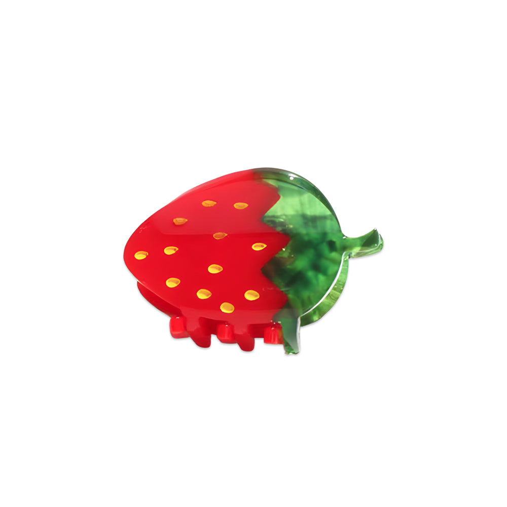 Strawberry-shaped hair clip on a white background