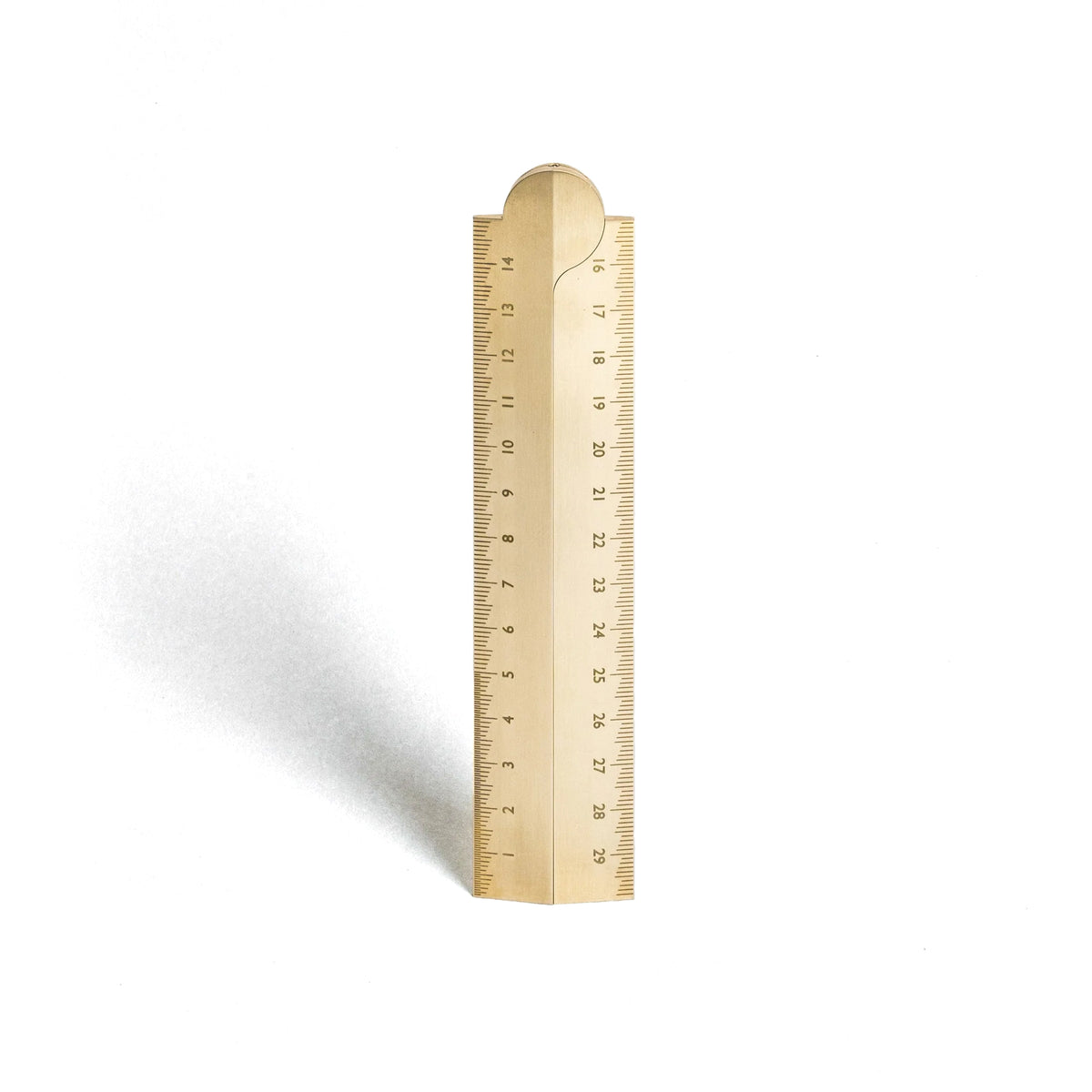 Brass ruler on a white background
