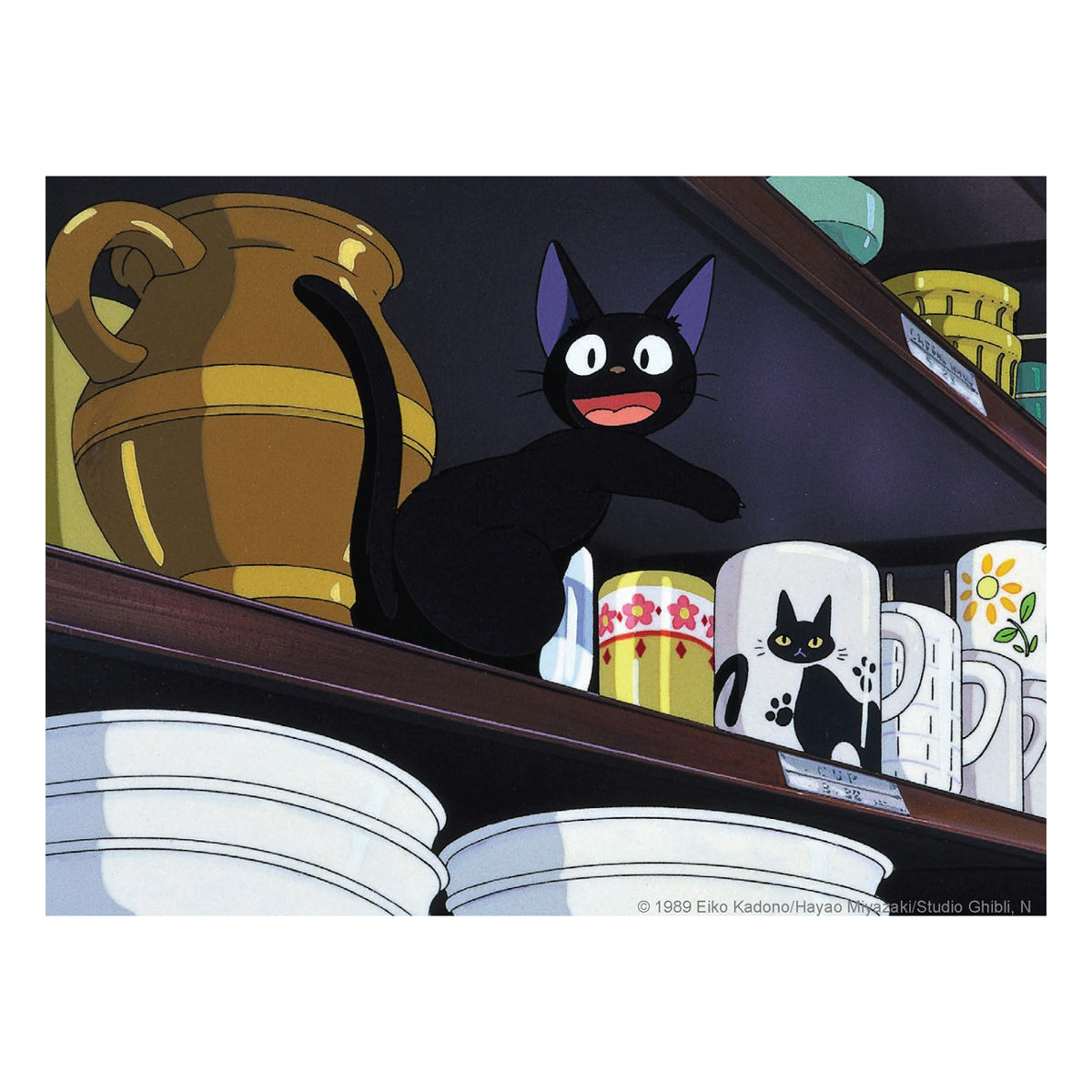 A square art print featuring a scene from Studio Ghibi's animated film 'My Neighbor Totoro' with Jiji the black cat sitting on a wooden shelf among mugs and dishes.