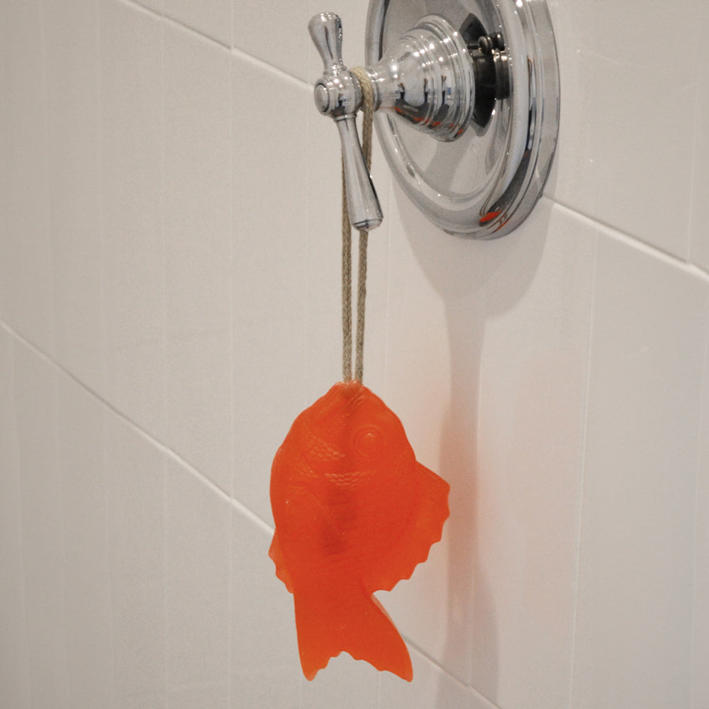 Soap hanging from shower knob.