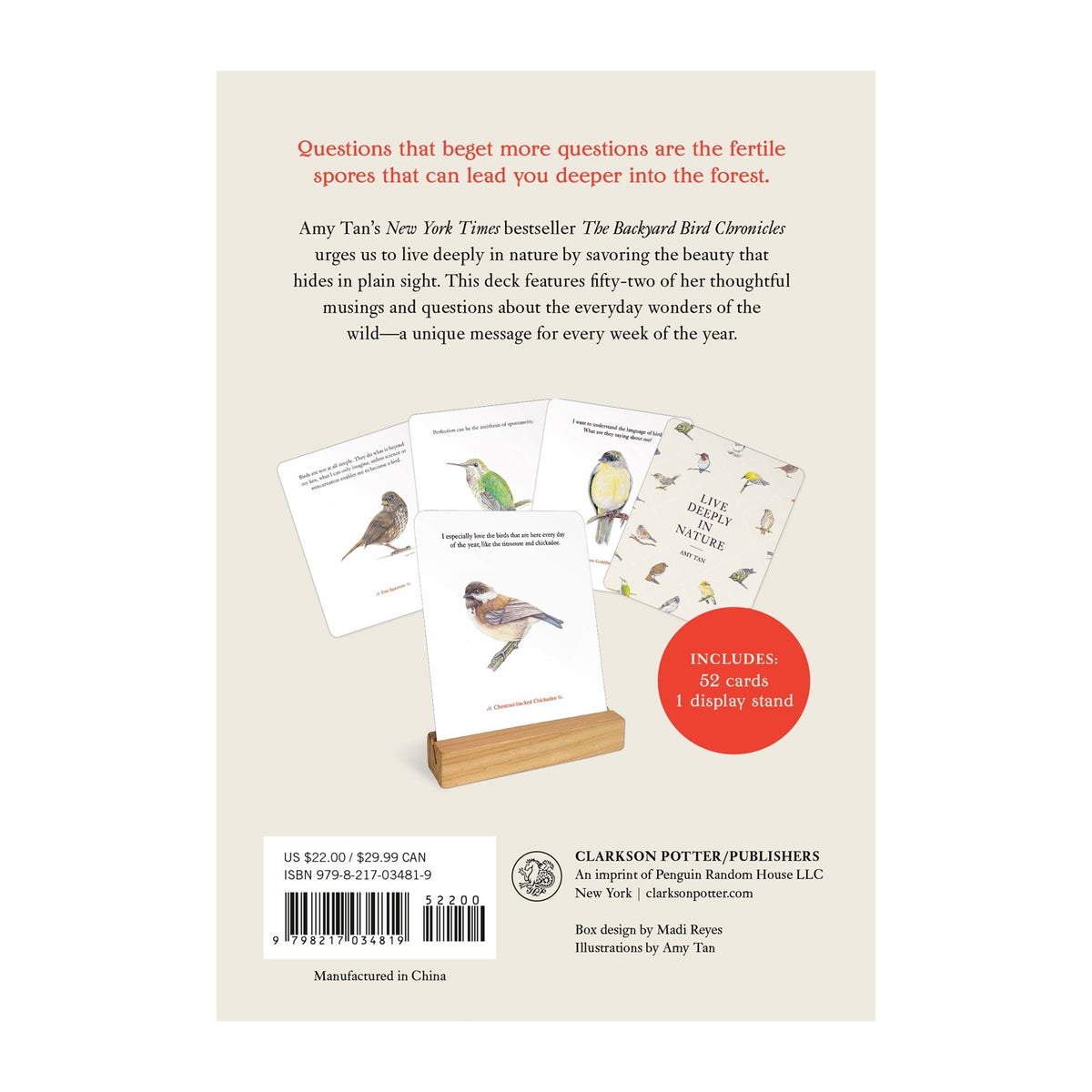 Back cover of The Backyard Bird Deck by Amy Tan, showing the title, descriptive text, sample bird cards, a wooden card stand, barcode, and publisher information on a beige background.
