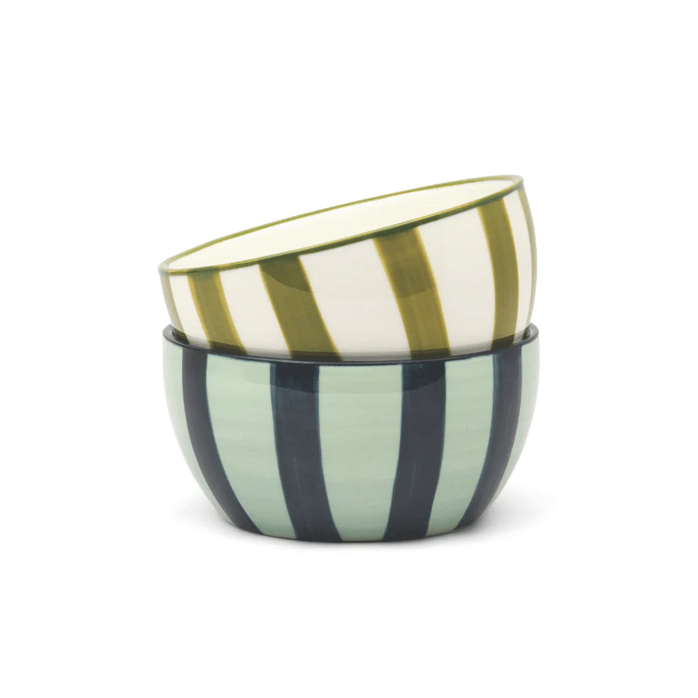 Two ceramic bowls with striped patterns on a white background