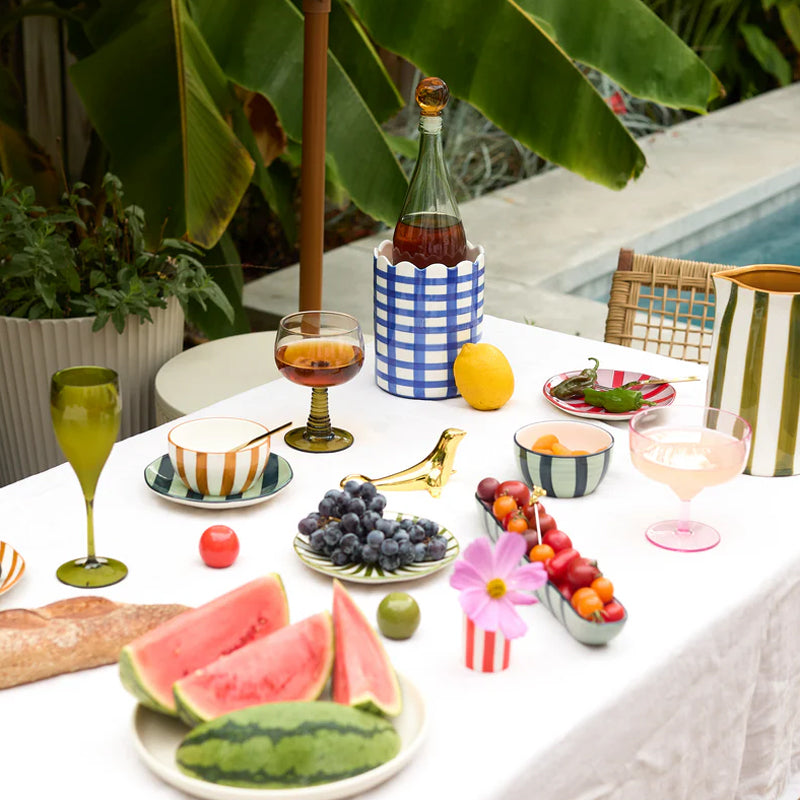 Two ceramic bowls with striped patterns on a white background