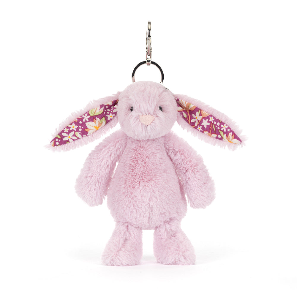 Pastel purple plush bunny keychain with floral ears on a white background