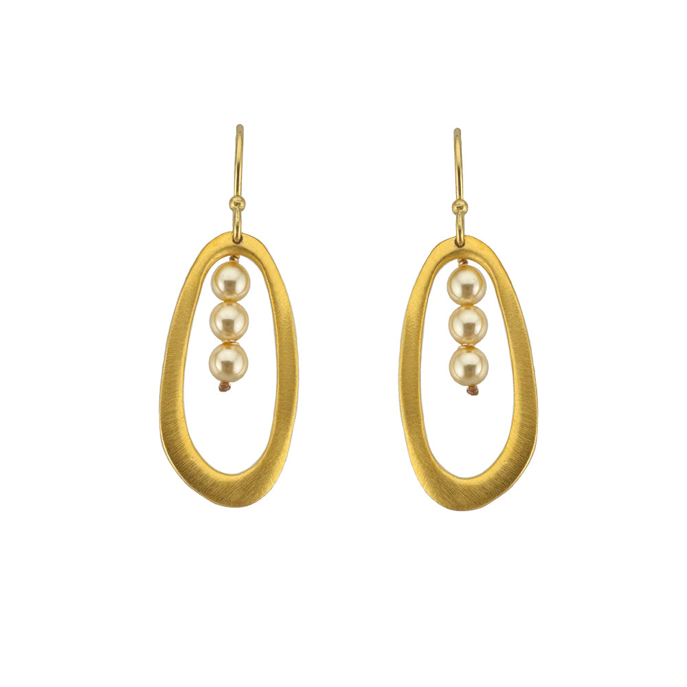 Gold oval earrings with pearl beads on a white background