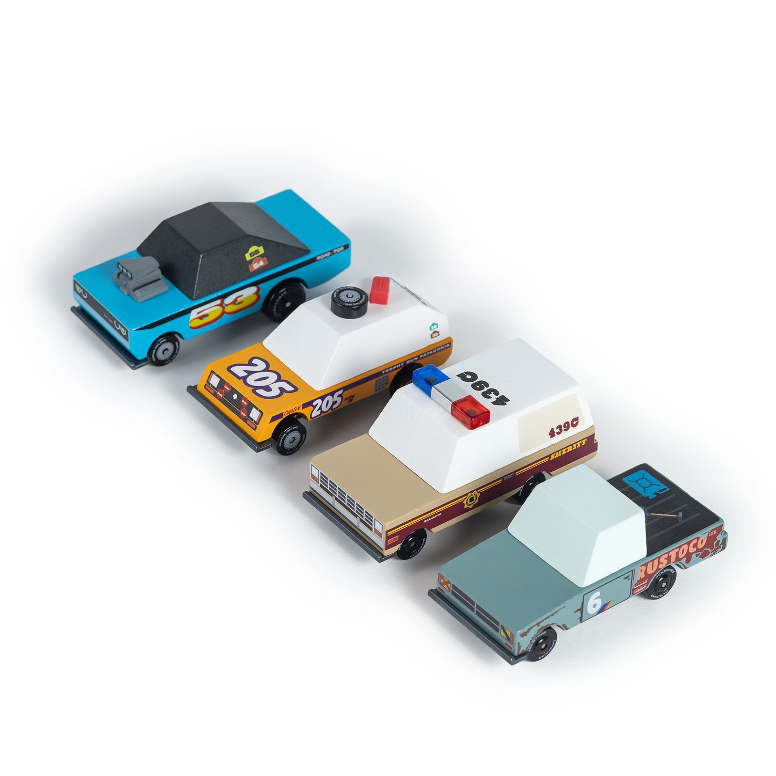 Four toy cars on a white background